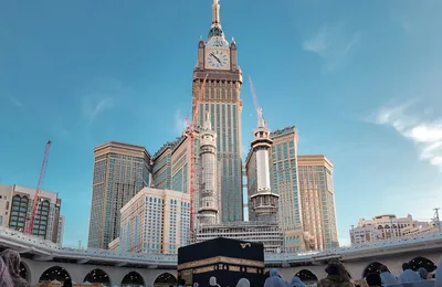 Makkah skyline and Clock Tower at night — umrah packages uk